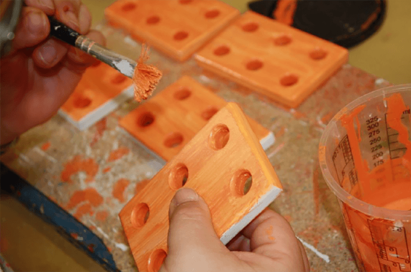 Wood is painted and processed into high-quality wooden toys.