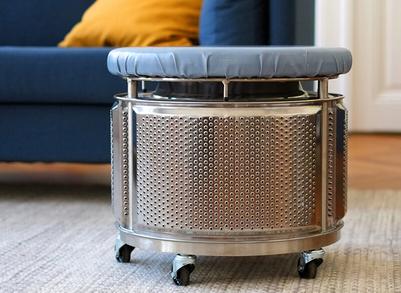 Stool made from an old washing machine drum by trash.design